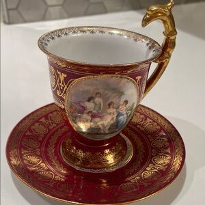 Elegant Red and Gold Porcelain Cup and Saucer Set